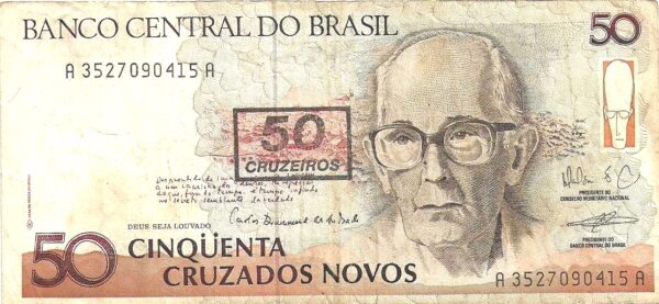 Br Cédula, 50 Cruzados Novos (Carimbada 5 Cruzeiros), Calcografia nas cores cinza e marrom, efígie de Carlos Drummond de Andrade. Impressão Casaa Moeda do Brasil. (Padrão Cruzados Novos, 1990).